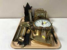 A tray of small brass propeller, brass ship's style clock, mantel clock, thermometers,
