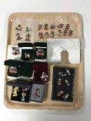 A collection of thirty-one Golly pin badges