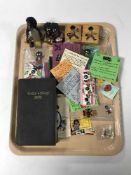 A tray containing assorted Golly pin badges, collectors club badges, stamps,