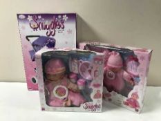 Eight Snuggles delux dolls together with a snuggles delux dolls buggy, all parts boxed.