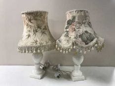 A collection of eleven assorted china marble and alabaster table lamps with shades