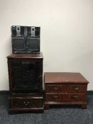 An audio cabinet containing hi/fi and speakers,