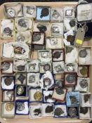 A tray containing a large quantity of boxed plated fobs,