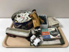 A tray containing assorted tea cards, vintage marbles,