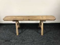 A rustic pine bench