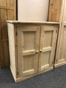 A pine two door cupboard