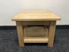An oak two tier lamp table