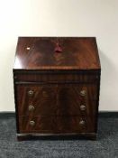 An inlaid mahogany fitted writing bureau