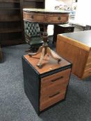 A two drawer filing chest and leather top drum table