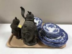 A tray of two cast metal Buddha heads,