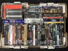 Two boxes containing a quantity of assorted DVD's and box sets including James Bond, Indiana Jones,