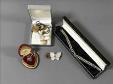 A silver dress ring, rolled gold lockets,