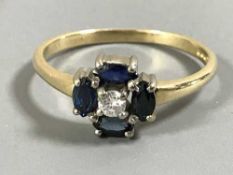 An 18ct gold sapphire and diamond cluster ring