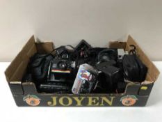 A box containing a quantity of assorted cameras including Samsung, Polaroid, Nikai,