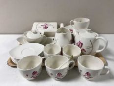 A tray containing a twenty-nine piece Carlton ware hand-painted tea service