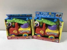 Twelve boxed Funtime fire engines