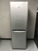 An Indesit silver fridge freezer