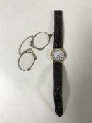 A wristwatch by Margaret Howell on leather strap together with a pair of early spectacles