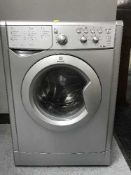 An Indesit silver washing machine