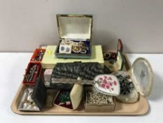 A tray containing mid-20th century lady's soap sets, costume jewellery, simulated pearls,