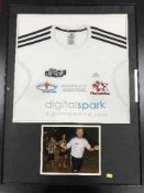 A framed Emil Ezopec photographic montage and a framed digital spark Geordie Run shirt