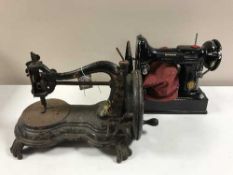 An antique hand sewing machine and a Singer electric sewing machine