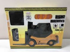 Two boxed Toyrifie mean machines forklift and a boxed Mega Machines Super Loader