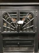 A Dimplex electric fire in the form of a stove together with a radiator