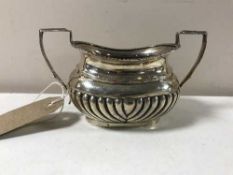 A silver twin handled sugar basin