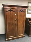 An early Victorian mahogany double door wardrobe