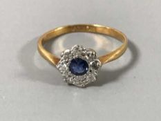 A sapphire and diamond cluster ring