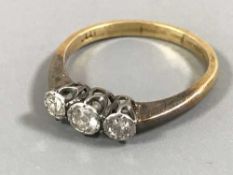 An 18ct gold three stone diamond ring
