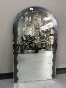 A frameless etched dome top mirror together with two other frameless wall mirrors