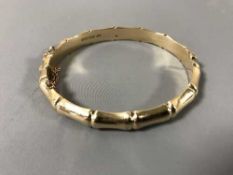 A 9ct gold bamboo textured bangle, 12.