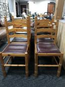 Four pine ladder back chairs