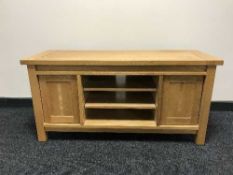 A contemporary oak audio stand