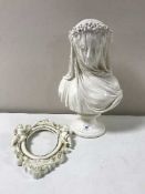 A chalk bust of a lady in veil,