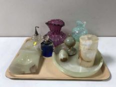 A tray containing a glass paperweight, a pink glass vase, Caithness vase,