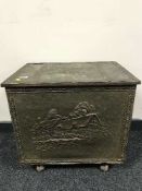 A large brass embossed coal receiver