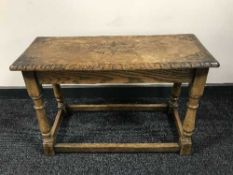 A carved oak stool