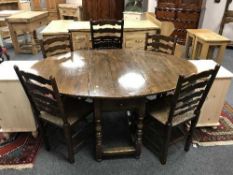 A good quality Chapman's oak drop leaf dining table and five chairs