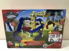 A boxed Chuggington stack track train set and eight boxes of Chuggington stack track trains