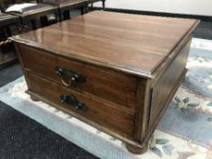 A reproduction square coffee table