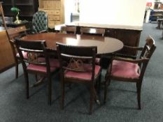 An eight piece inlaid mahogany Regency style dining room suite