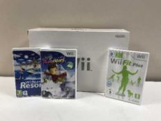 A boxed Nintendo Wii and a crate of Wii games and accessories etc