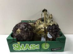 A box containing an ornate brass chandelier, gilt wall shelf,