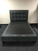 A 4'6 storage bed with headboard
