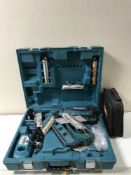 A Makita GN900 nail gun with battery and charger in case plus a Makita cleaning kit