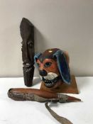 A Ecuadorian Corpus Christi mask on stand in the form of a dog,