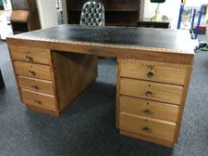 An early 20th century twin pedestal desk